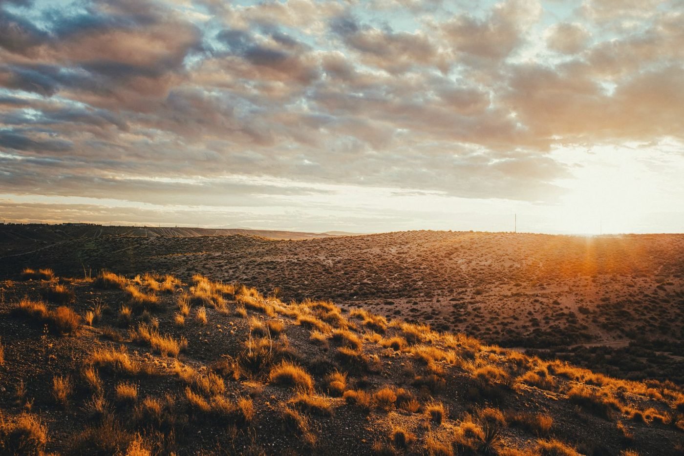 New Mexico high desert under a broken sky at last light